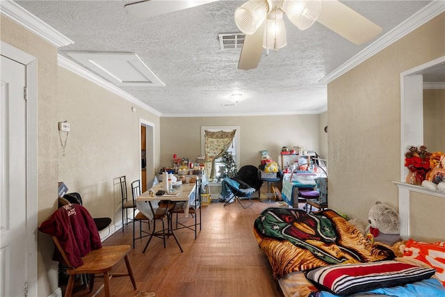 dining room with a textured ceiling and crown molding