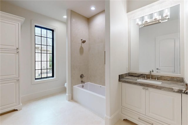 bathroom with a wealth of natural light, vanity, and toilet