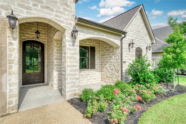 3317 Legacy Ct, Bryan, TX 77802 - entrance to property with roof with shingles and stone siding