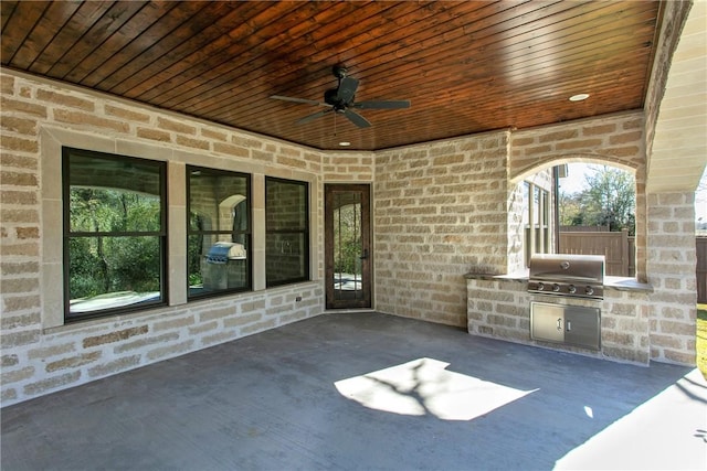 view of patio / terrace featuring an outdoor kitchen, area for grilling, and ceiling fan