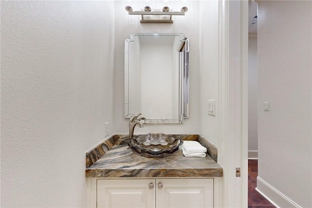 bathroom featuring vanity and hardwood / wood-style flooring