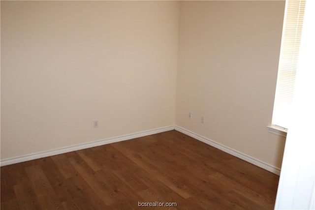 empty room featuring dark hardwood / wood-style floors