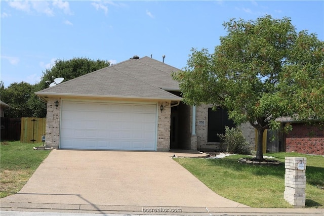 ranch-style home featuring a front lawn and a garage