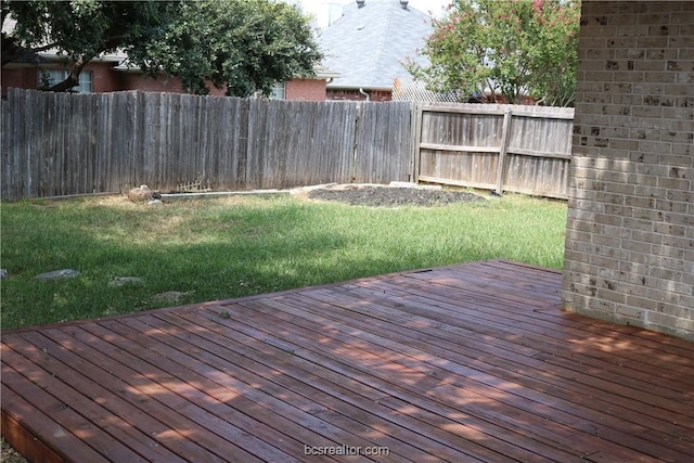 wooden terrace with a yard