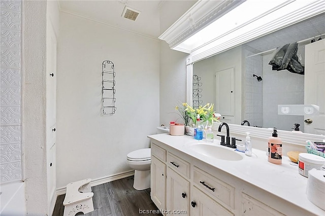 bathroom with vanity, toilet, and wood-type flooring