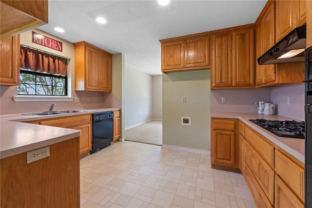 kitchen with a sink, recessed lighting, light countertops, under cabinet range hood, and black appliances