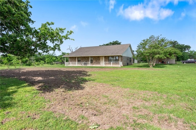 exterior space with a front yard and covered porch