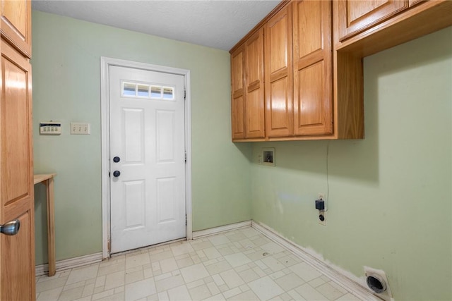 laundry area featuring light floors, hookup for a washing machine, baseboards, electric dryer hookup, and cabinet space