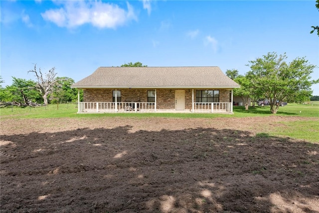 rear view of property with brick siding