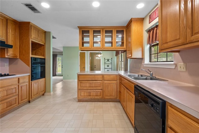 kitchen featuring a peninsula, a sink, visible vents, recessed lighting, and black appliances