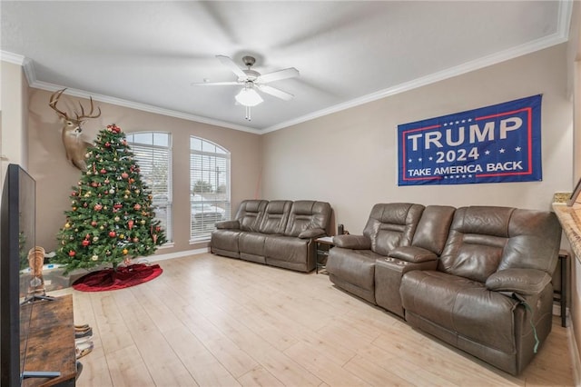 living room with ceiling fan, wood-type flooring, and ornamental molding