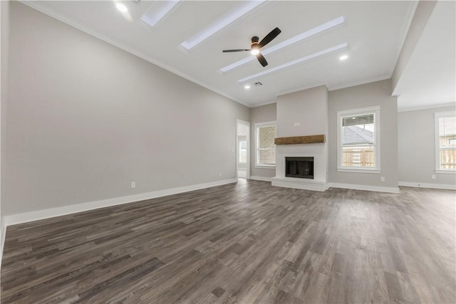 2916 Bombay Ct, Bryan, TX 77808 - unfurnished living room with dark wood finished floors, ornamental molding, a ceiling fan, baseboards, and a fireplace with raised hearth