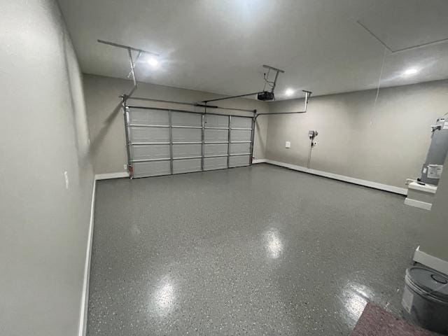2916 Bombay Ct, Bryan, TX 77808 - garage featuring a garage door opener and baseboards