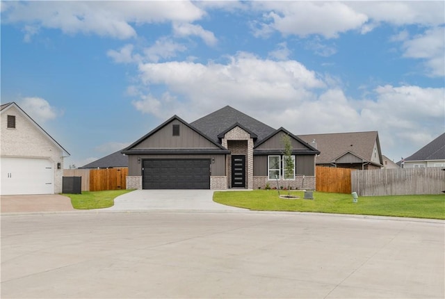 2916 Bombay Ct, Bryan, TX 77808 - view of front of home featuring driveway, brick siding, board and batten siding, and an attached garage