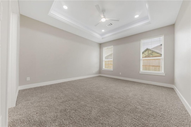 2916 Bombay Ct, Bryan, TX 77808 - carpeted spare room with a tray ceiling, a ceiling fan, recessed lighting, and baseboards