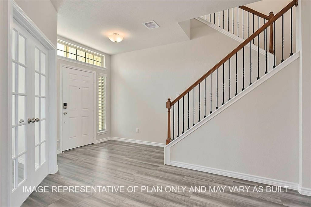 entrance foyer with wood-type flooring