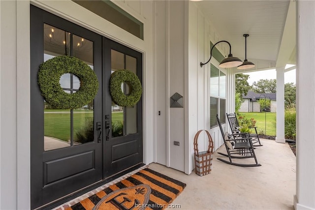 property entrance with french doors and a porch