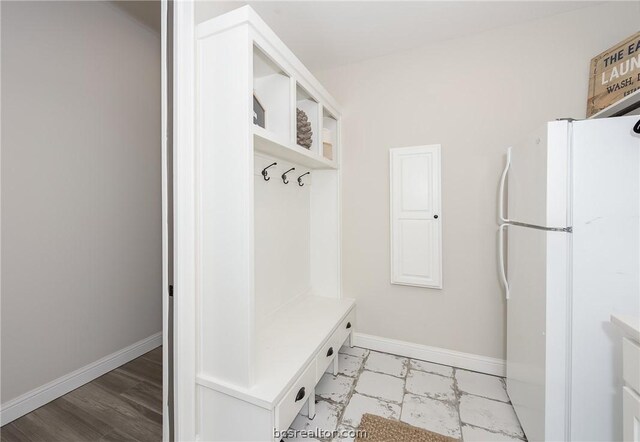 mudroom with light hardwood / wood-style flooring