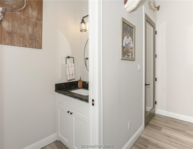 bathroom with vanity and hardwood / wood-style flooring