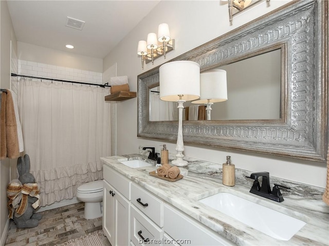 full bathroom with shower / bathtub combination with curtain, vanity, and toilet