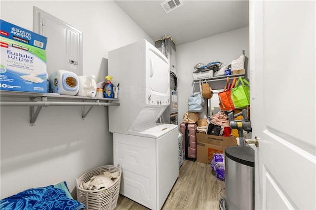 1326 Prairie Dr Unit 113, Bryan, TX 77803 - laundry room featuring estacked washer and dryer and light wood finished floors