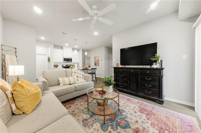 1326 Prairie Dr Unit 113, Bryan, TX 77803 - living room featuring baseboards, a ceiling fan, recessed lighting, and light wood-style flooring