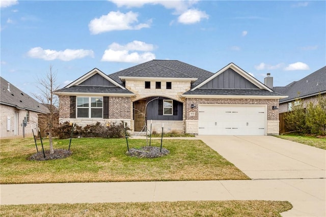 view of front of property featuring a garage, brick siding, concrete driveway, a front lawn, and board and batten siding