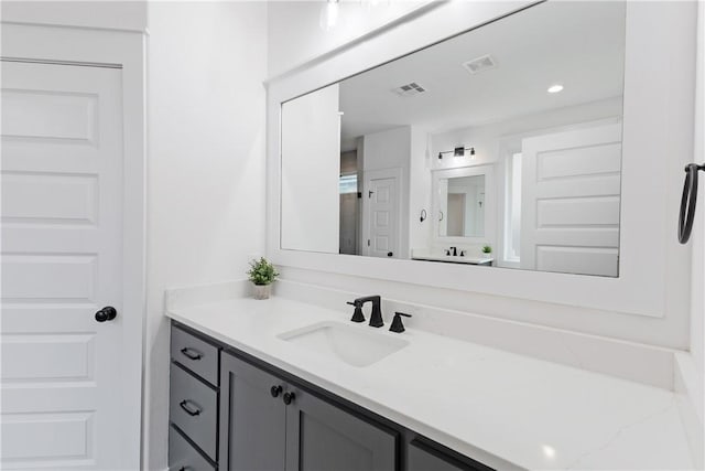 bathroom with visible vents and vanity