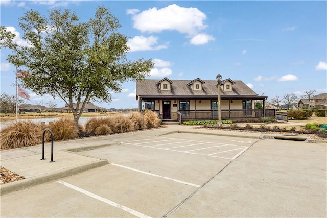 view of front of property featuring uncovered parking