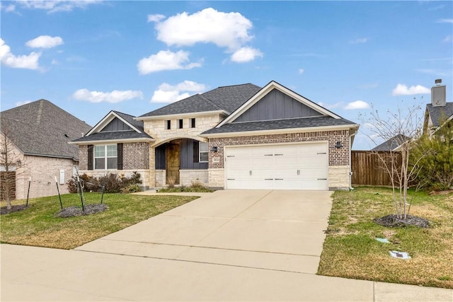 view of front facade with board and batten siding, fence, a garage, driveway, and a front lawn