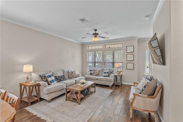 1611 Park Pl, College Station, TX 77840 - living area featuring a ceiling fan, ornamental molding, and dark wood-style flooring