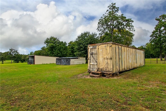 view of outbuilding with a lawn