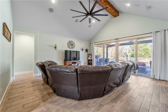 living room with ceiling fan, beam ceiling, and high vaulted ceiling