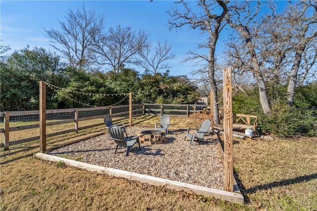 view of yard with a fire pit