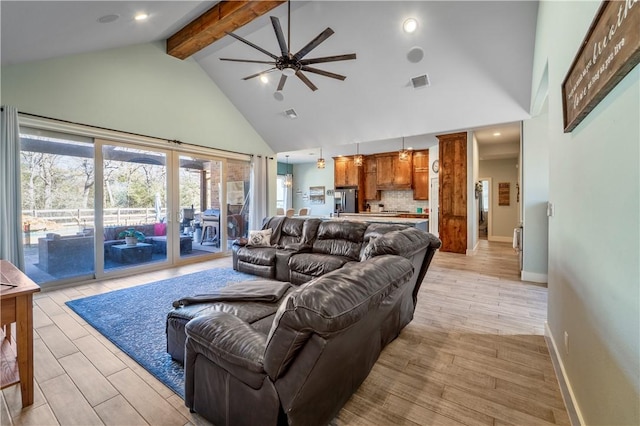 living room with ceiling fan, beam ceiling, and high vaulted ceiling