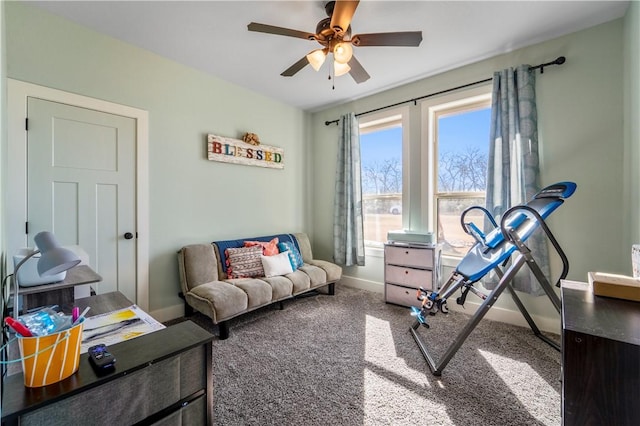 interior space with carpet floors and ceiling fan