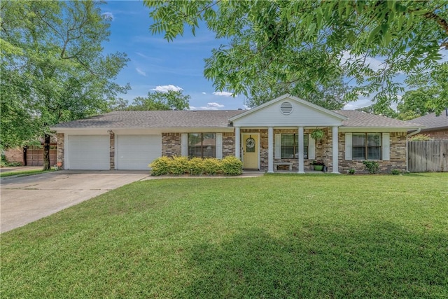 ranch-style home featuring a front lawn and a garage