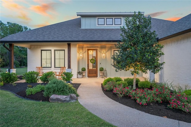 view of front of house featuring a porch and a shingled roof