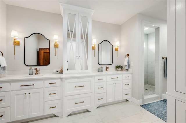 bathroom with marble finish floor, a sink, double vanity, and a tile shower