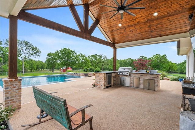 view of patio / terrace featuring a gazebo, an outdoor pool, a ceiling fan, and area for grilling