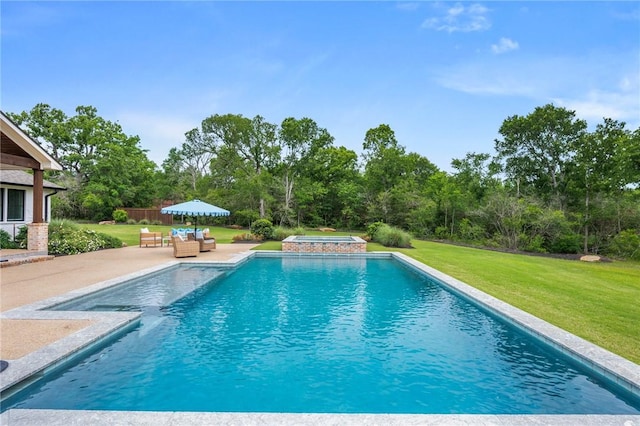 pool with an outdoor living space, a patio, a yard, and an in ground hot tub