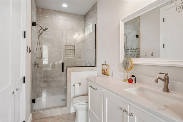 full bath featuring vanity, recessed lighting, a shower stall, and toilet