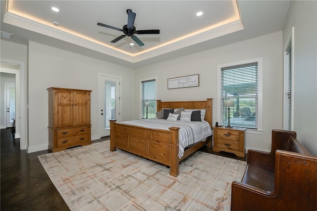 7532 Marys Way, Bryan, TX 77808 - bedroom with a tray ceiling, finished concrete flooring, recessed lighting, baseboards, and a ceiling fan