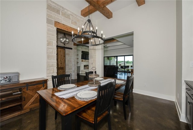 7532 Marys Way, Bryan, TX 77808 - dining room with baseboards, beam ceiling, a chandelier, concrete flooring, and a stone fireplace