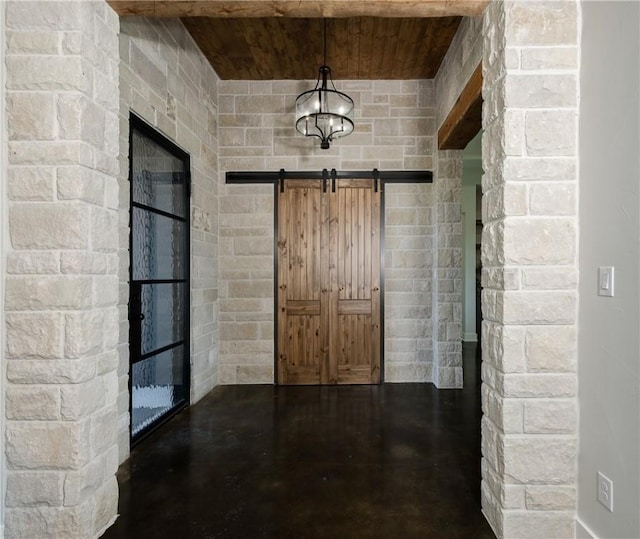 7532 Marys Way, Bryan, TX 77808 - corridor featuring finished concrete floors, wooden ceiling, and a barn door
