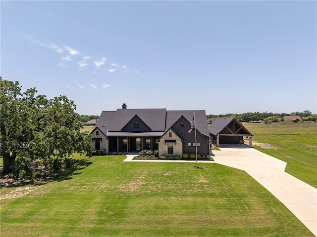 7532 Marys Way, Bryan, TX 77808 - view of front of home featuring driveway, a front lawn, a carport, and a standing seam roof