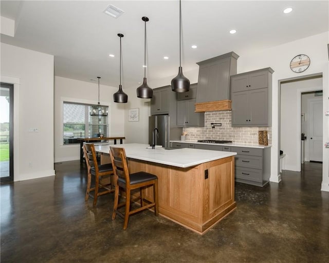 7532 Marys Way, Bryan, TX 77808 - kitchen featuring finished concrete flooring, gray cabinetry, stainless steel appliances, tasteful backsplash, and recessed lighting