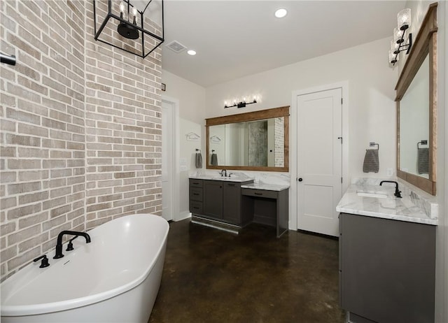 7532 Marys Way, Bryan, TX 77808 - full bath with finished concrete flooring, brick wall, a freestanding tub, two vanities, and recessed lighting