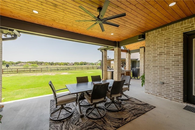 7532 Marys Way, Bryan, TX 77808 - view of patio with a ceiling fan, outdoor dining space, and a rural view