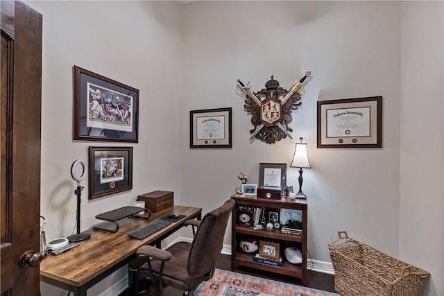 office space featuring wood finished floors and baseboards